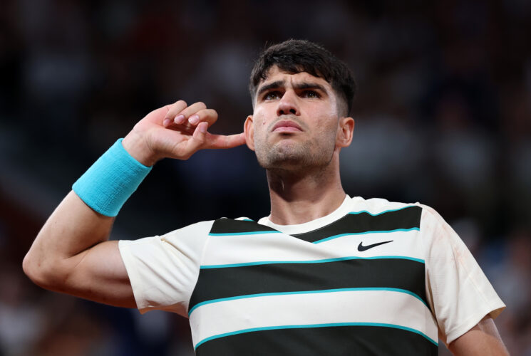Alcaraz fights off Dzumhur to keep title defence alive in Paris