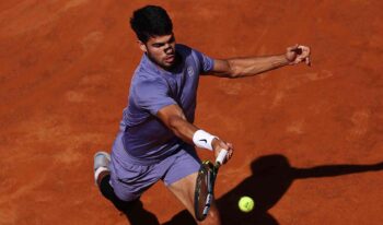 ROME, ITALY – MAY 16: Carlos Alcaraz of Spain plays a forehand during his match against Lorenzo Musetti of Italy in the Men’s semi-final on Day Twelve of the Internazionali BNL D’Italia at Foro Italico Day Twelve of the Internazionali BNL D’Italia at Foro Italico on May 16, 2025 in Rome, Italy. (Photo by Dan Istitene/Getty Images)